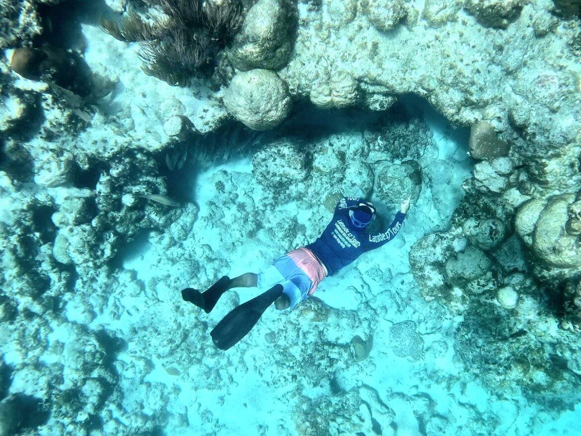 Snorkeling with Latitude 17 Tours at Hol Chan Channel in Belize.